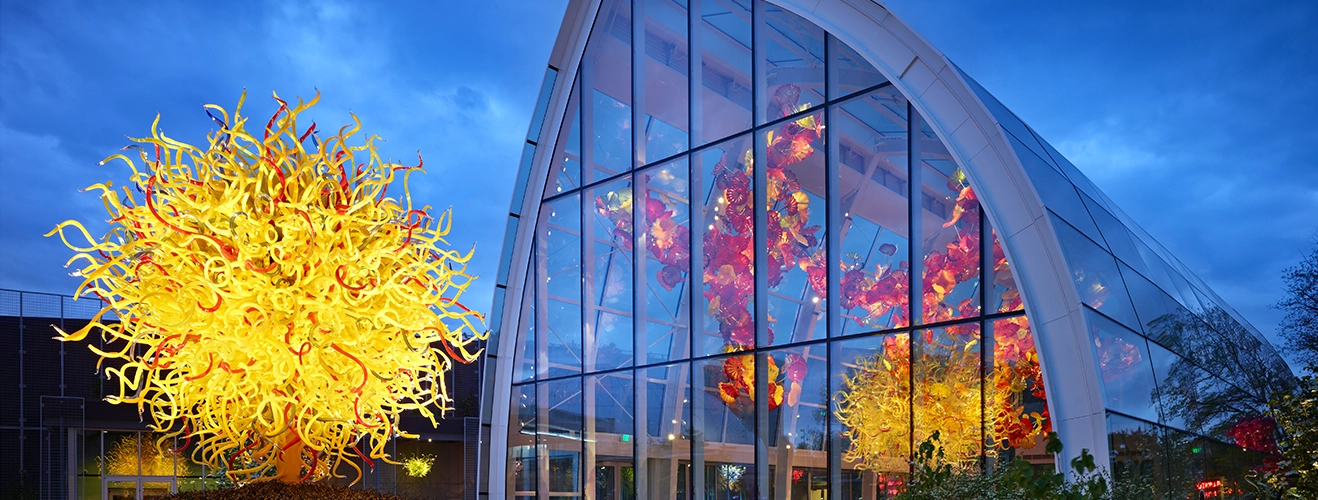 Chihuly Garden & Glass exterior at dusk